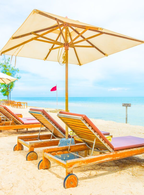 Umbrella and chair on beautiful tropical beach